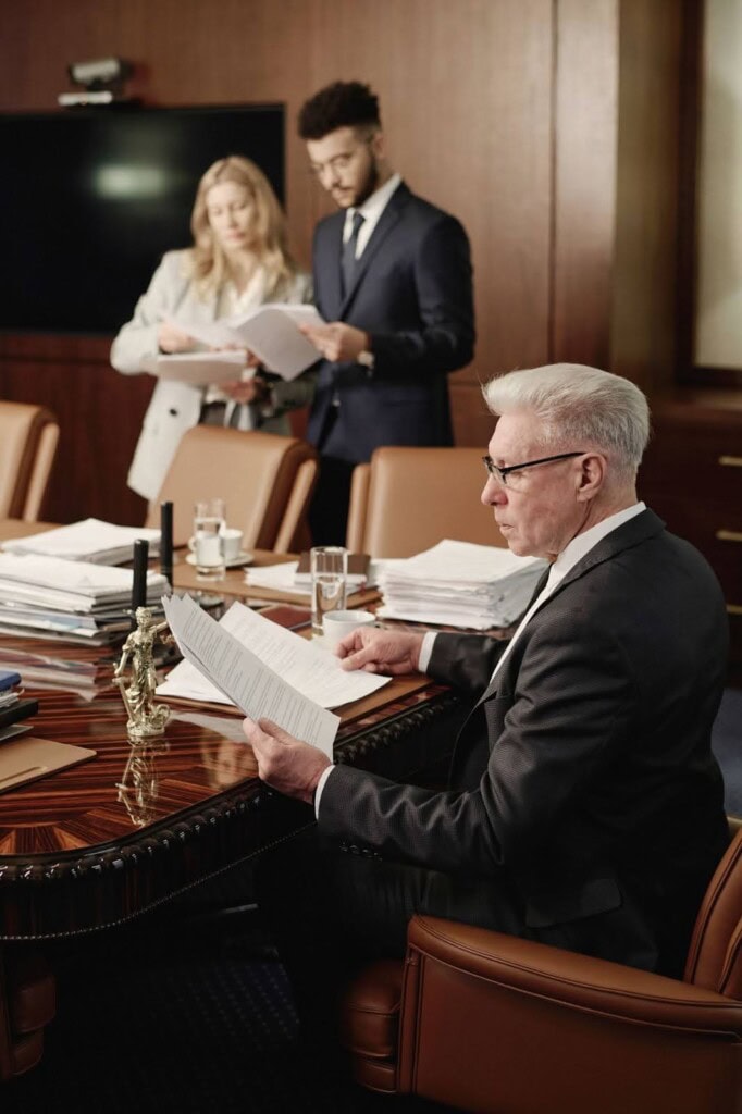 Counsel looking through case documents and reviewing evidence